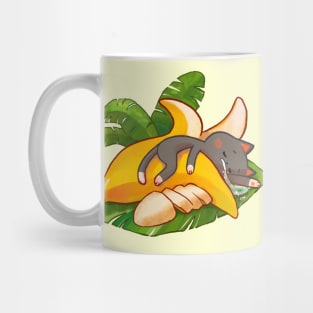 Cute cat sleeping in a banana Mug